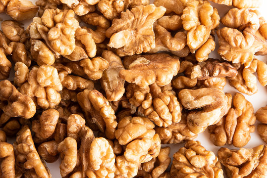 Lay flat Walnut dry fruits against a white background for a wall paper
