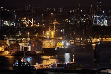 Container ship and cranes in an old dock in Rotterdam Waalhaven