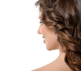 Beautiful young woman with curly hair on white background