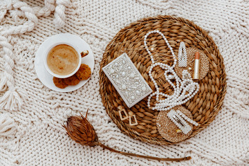 Flat Lay Still Life, Lifestyle concept. Fashion, beauty,  blogger. Coffee cup and women's accessories on white blanket.