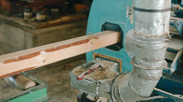 Planks come out of the woodworking machine