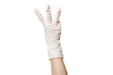 hand in a white sterile medical glove shows gesture three fingers, close-up mock-up isolated on a...