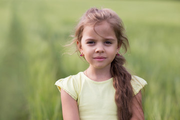 portrait of a little girl  in nature