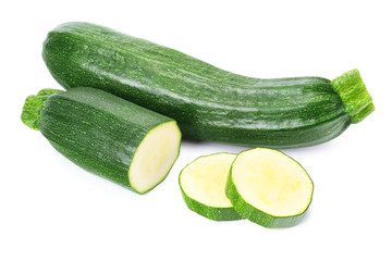 fresh green zucchini with slices isolated on white background.