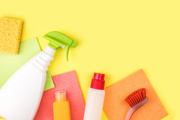 House cleaning products are on yellow background.