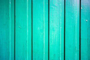 Turquoise wooden panel closeup shot. Texture and design concept.