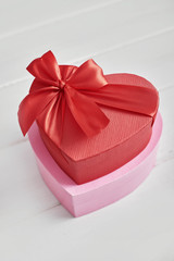 Red and pink gift box with on white background.