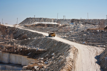 Marble quarry. A dumper rides in a career