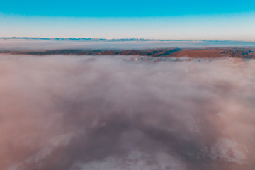 Foggy winter morning in mountain village with top view