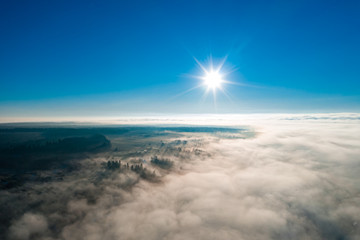 Wonderful foggy morning in the Ukrainian village on the Carpathian Mountains with sunshine