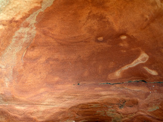 Geological sandstone outcrop, close-up of an abstract wavy pattern