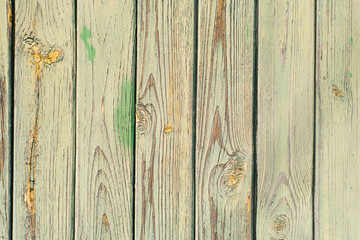Old wooden plank background. Peeling green paint on old boards. Copying space