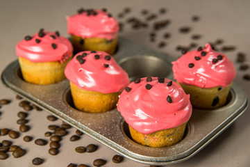 muffins with red cream and chocolate chips