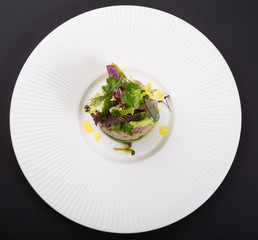 Freshly cooked tartare served with lime on white plate