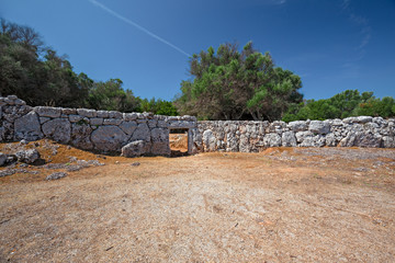 Panoramic view of the wall, of the archaeological site of Naveta des Tudons on the island of Menorca in Spain.