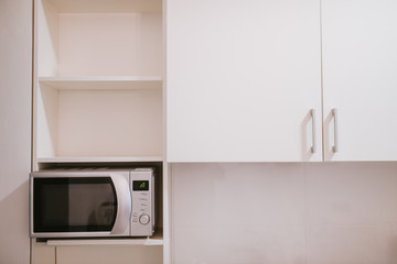 Beautifully decorated white kitchen in a luxury apartment