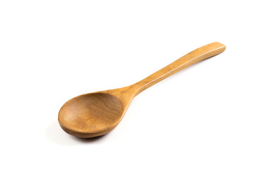 Wooden spoon isolated on white .