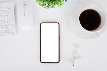 Cropped shot view of  the mobile phone with blank copy space screen for your information content or text message on the office desk, work from home.