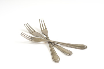 Metal fork on white background.