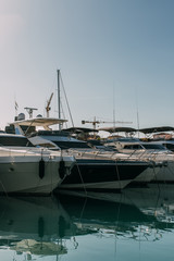 Fototapeta premium sunshine on docked and modern yachts in mediterranean sea