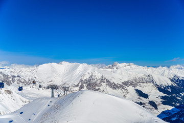 Fototapeta na wymiar Ski lift to the top of the Austrian Alps in snowy mountains