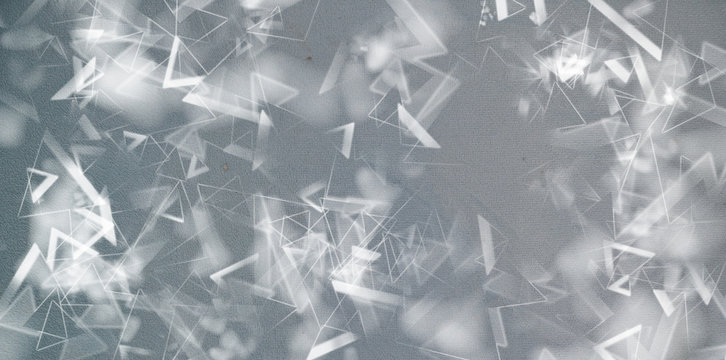 Detail of broken glass texture on gray background