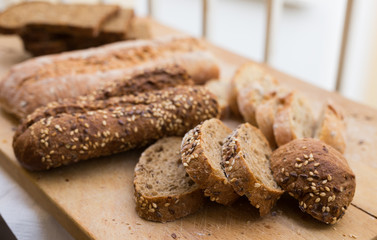 fresh loaf of bread on wooden board