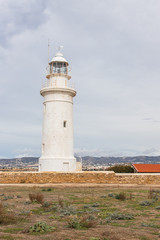 Fototapeta na wymiar white and old lighthouse in cyprus