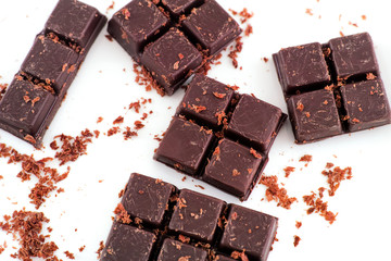 Homemade dark chocolate on a white background