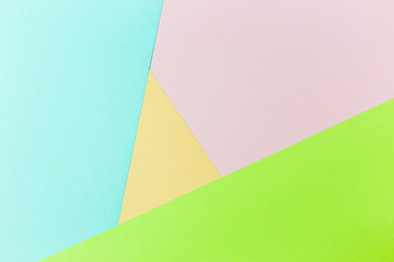 Pastel papers color background is nested backdrop flat lay. green, light green, pink, yellow, blue