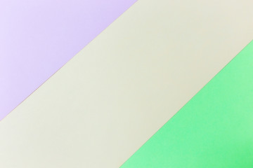 Pastel papers color background is nested backdrop flat lay. green, pink, orange