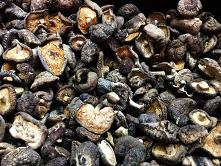 Dried Shiitake on a vintage background as detailed close-up shot, selective focus