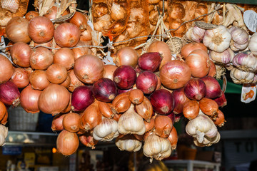 Background of fresh pile of onions at the market