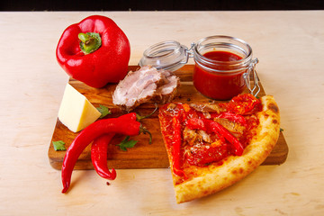 fresh pizza with ingredients in it on a wooden board