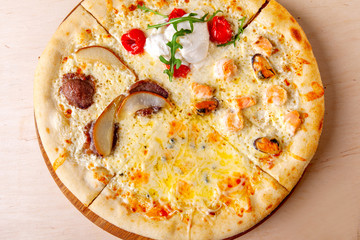 fresh pizza with ingredients in it on a wooden board
