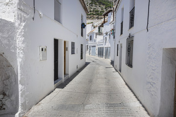 Fototapeta na wymiar Beautiful view of Mijas Picturesque Narrow Street. Mijas - Spanish hill town overlooking the Costa del Sol, not far from Malaga. Mijas known for its whitewashed buildings. Mijas, Andalusia, Spain.