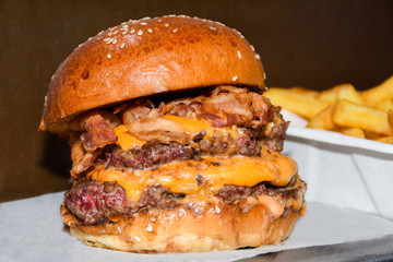 Fresh melting burger ready to eat during fast food festival.