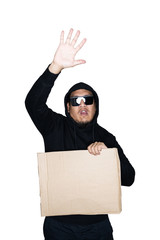 Bearded asian men  dressed in black hoody is holding cardboard with open hand doing stop sign in white background.The concept of protest. Place for text or copy space. Clipping path.