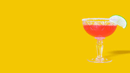 Banner for summer pool party. Strawberry daiquiri with lime in saucer champagne. Tempting and refreshing alcoholic drink in crystal glass on saturated summer yellow background. Summer concept.