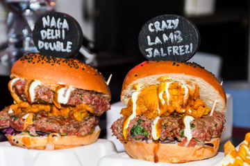 Fresh melting burger ready to eat during fast food festival.