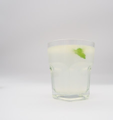 Homemade fresh lime juice and water with sugar syrup.  Lemon balm leaf for flavour and decoration. Copy space