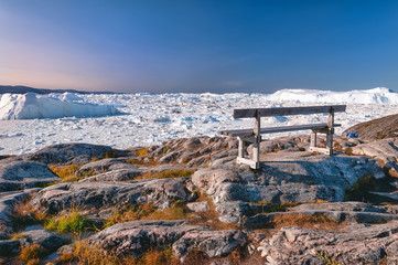 The lonely bench on the hiking trail to Sermermiut, Greenland. Sermermiut was an Inuit settlement...