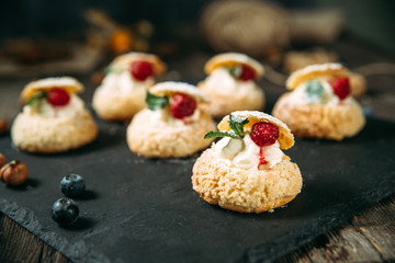 Gourmet dessert cookies with cream and berries