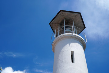 Fototapeta na wymiar Lighthouse with clear blue sky background at Tang Kuan Mountain Songkhla