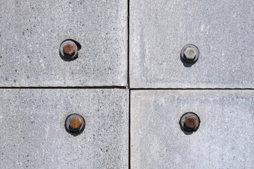 metall background with bolts and rivets. Industrial texture backdrop