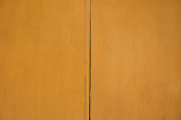 Closeup Yellow Wooden door texture background - abstract surface with copy space                                
