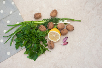 Healthy foods greens nuts lemon garlic . Food is proper nutrition. Vegetarian food