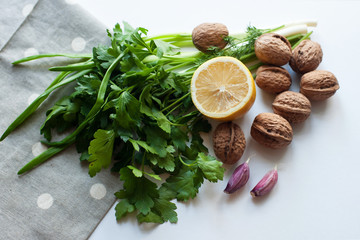 Fototapeta na wymiar Healthy foods greens nuts lemon garlic . Food is proper nutrition. Vegetarian food