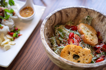 Healthy  salad bowl on a wooden table. View over the food concept