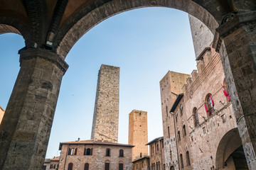 Fototapeta premium View of the famous towers from the historic center of the village of San Gimignano, a heritage of humanity, on a summer morning